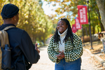 Two students talking to each other. Links to Gifts by Will