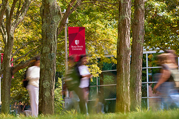 Students walking next to trees. Links to Gifts That Pay You Income
