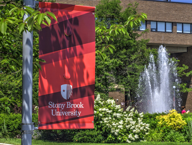 Photo of a building on campus Stonybrook banner in front